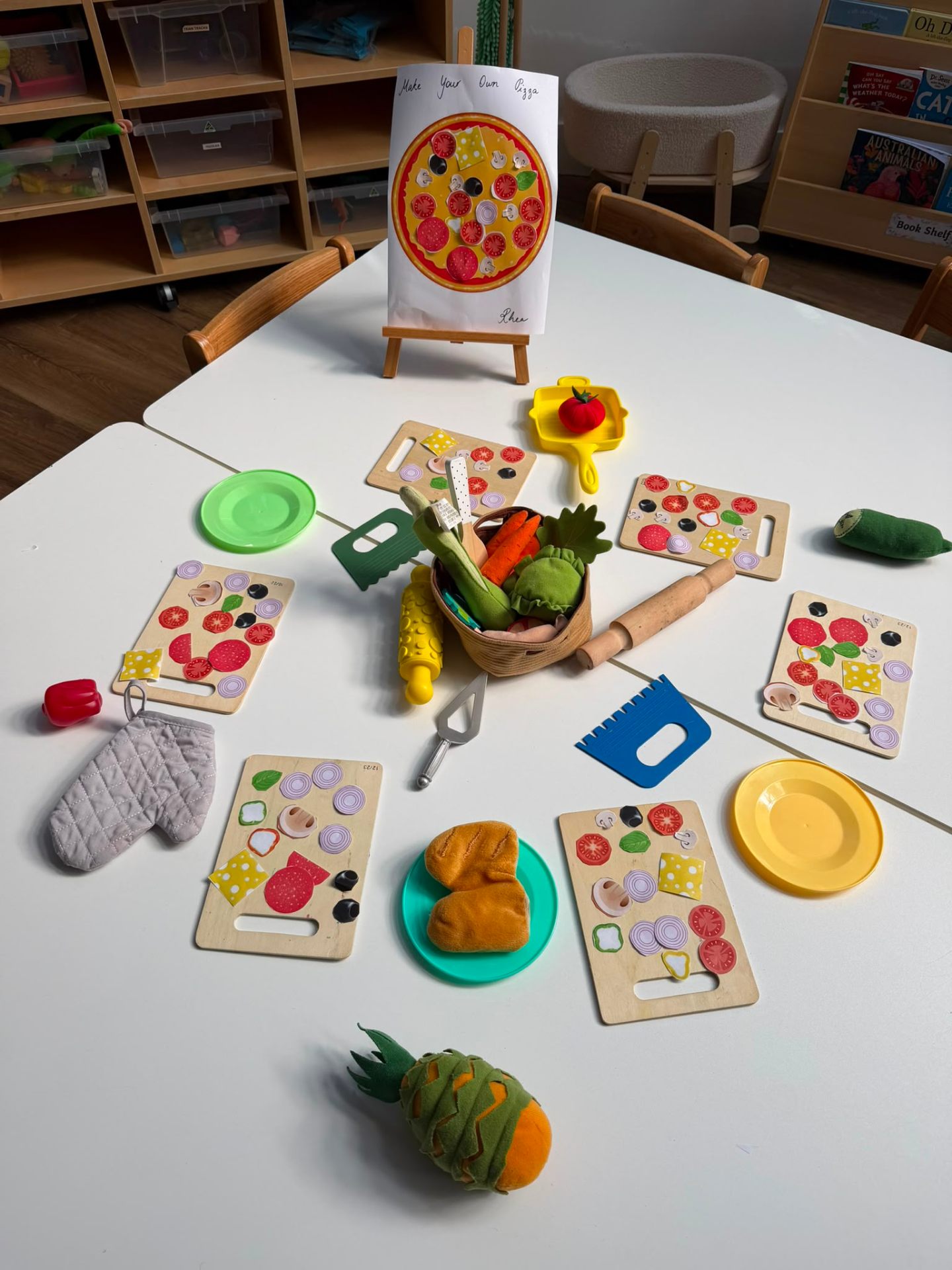 Make-your-own-pizza felt play experience set up on a table